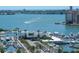 Beautiful aerial view of the marina and ocean with boats, yachts, and waterfront buildings on a sunny day at 1732 Hillview St, Sarasota, FL 34239