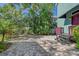 Brick paved patio with lush landscaping and tropical plants at 1732 Hillview St, Sarasota, FL 34239