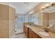 Elegant bathroom with granite double vanity and walk-in shower at 1732 Hillview St, Sarasota, FL 34239