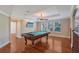 Game room featuring a pool table, hardwood floors, and a mounted television at 1732 Hillview St, Sarasota, FL 34239