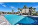 Community pool with lounge chairs at 17704 Gawthrop Dr # 103, Bradenton, FL 34211