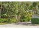 Private gated entrance to a lush tropical property at 1776 Casey Key Rd, Nokomis, FL 34275