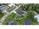 Aerial view highlights landscaping, nearby pools, and community setting for a desirable location at 1859 Lamont St, North Port, FL 34288