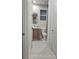 Modern bathroom with wood vanity, framed mirror, and toilet, showcasing contemporary design in a compact space at 1859 Lamont St, North Port, FL 34288