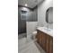 Modern bathroom features a glass-enclosed shower, sleek vanity with sink, and contemporary fixtures and finishes at 1859 Lamont St, North Port, FL 34288