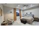 Cozy bedroom features a neutral color palette, tray ceilings, and plush bedding, creating a warm and inviting atmosphere at 1859 Lamont St, North Port, FL 34288