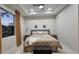 Serene bedroom features a tray ceiling, plush carpeting, and natural light, creating a peaceful retreat at 1859 Lamont St, North Port, FL 34288