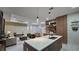 Modern kitchen features a spacious island with quartz countertop, perfect for gathering and entertaining at 1859 Lamont St, North Port, FL 34288