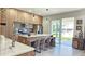 Modern kitchen features sleek cabinets, stainless steel appliances, a breakfast bar, and easy access to the patio at 1859 Lamont St, North Port, FL 34288