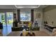 Bright living room featuring large windows, stylish furniture, and tasteful decor for comfortable living at 1859 Lamont St, North Port, FL 34288