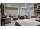Bright and airy open-concept living space features a modern kitchen, cozy living room, and dining area at 1859 Lamont St, North Port, FL 34288