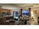 Open-concept living space featuring a modern kitchen, dining area, and comfortable living room with lots of light at 1859 Lamont St, North Port, FL 34288