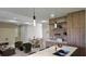 Bright and airy living space with modern lighting, comfortable seating, and a dining area at 1859 Lamont St, North Port, FL 34288