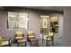 Outdoor patio area with comfortable seating, a view into the dining area, and a cozy atmosphere for relaxation at 1859 Lamont St, North Port, FL 34288