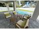 Relaxing outdoor space with comfortable seating, perfect for enjoying the poolside view and outdoor entertaining at 1859 Lamont St, North Port, FL 34288