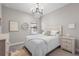 Bedroom with carved headboard and chandelier at 208 Ariano Ave, Nokomis, FL 34275