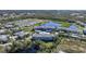 Aerial view of apartment buildings and a lake at 2121 Heron Lake Dr # 203, Punta Gorda, FL 33983