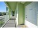 Building hallway with access to unit and other amenities at 2121 Heron Lake Dr # 203, Punta Gorda, FL 33983