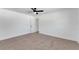 Spacious bedroom with ceiling fan and grey carpet at 2600 Barksdale Ct, Clearwater, FL 33761