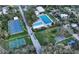 Community view including tennis courts, pool, and playground at 2674 Jefferson Cir, Sarasota, FL 34239