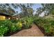 Landscaped walkway through backyard garden at 2674 Jefferson Cir, Sarasota, FL 34239