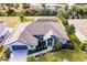 Single-story house, pool, and landscaped yard with a fenced perimeter at 301 Gold Tree, Punta Gorda, FL 33955