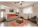 Bright bedroom with daybed, dresser, and colorful rug at 301 Gold Tree, Punta Gorda, FL 33955
