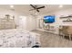 Bright bedroom with a comfortable bed, built-in desk, and ample closet space at 301 Gold Tree, Punta Gorda, FL 33955