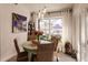 Casual dining area with a round table, four chairs, and large window overlooking backyard at 301 Gold Tree, Punta Gorda, FL 33955
