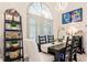 Formal dining area with black table, white chairs, and stylish décor at 301 Gold Tree, Punta Gorda, FL 33955