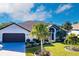 Beautiful house exterior with a well-manicured lawn at 301 Gold Tree, Punta Gorda, FL 33955