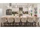 Large kitchen island with seating, stainless steel appliances, and white cabinetry at 301 Gold Tree, Punta Gorda, FL 33955