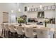 Modern kitchen with white cabinets, a large island, and stainless steel appliances at 301 Gold Tree, Punta Gorda, FL 33955