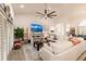 Spacious living room with large sectional sofa and sliding glass doors at 301 Gold Tree, Punta Gorda, FL 33955