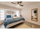 Main bedroom with a king-size bed and large windows at 301 Gold Tree, Punta Gorda, FL 33955