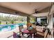 Enjoy this beautiful pool area with comfortable seating and a dining table at 301 Gold Tree, Punta Gorda, FL 33955
