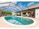 Relax and enjoy this refreshing pool with a screened enclosure at 301 Gold Tree, Punta Gorda, FL 33955
