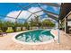 Inviting kidney-shaped pool with a screened enclosure at 301 Gold Tree, Punta Gorda, FL 33955
