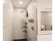 Modern shower with marble walls and multiple shelves at 301 Gold Tree, Punta Gorda, FL 33955