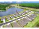 Two story house next to a lake at 33443 Landsman Loop, Wesley Chapel, FL 33543
