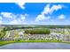 Two story house next to a lake at 33443 Landsman Loop, Wesley Chapel, FL 33543