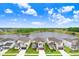 Community of two-story houses near a lake at 33443 Landsman Loop, Wesley Chapel, FL 33543