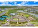 Community overview featuring tennis courts, playground, and lake at 33443 Landsman Loop, Wesley Chapel, FL 33543