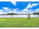 Spacious backyard with a lake view at 33443 Landsman Loop, Wesley Chapel, FL 33543