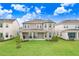 Large backyard with patio and landscaping at 33443 Landsman Loop, Wesley Chapel, FL 33543