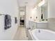 Spa-like bathroom with double vanity, soaking tub at 33443 Landsman Loop, Wesley Chapel, FL 33543
