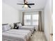 Bedroom with two twin beds and ceiling fan at 33443 Landsman Loop, Wesley Chapel, FL 33543
