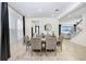 Spacious dining room with large table and gray chairs at 33443 Landsman Loop, Wesley Chapel, FL 33543