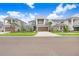 Two-story house on a tree lined street at 33443 Landsman Loop, Wesley Chapel, FL 33543