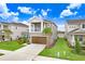 Two-story house with a lake view at 33443 Landsman Loop, Wesley Chapel, FL 33543